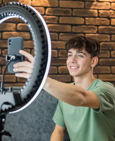 Creator filming himself with a ring light