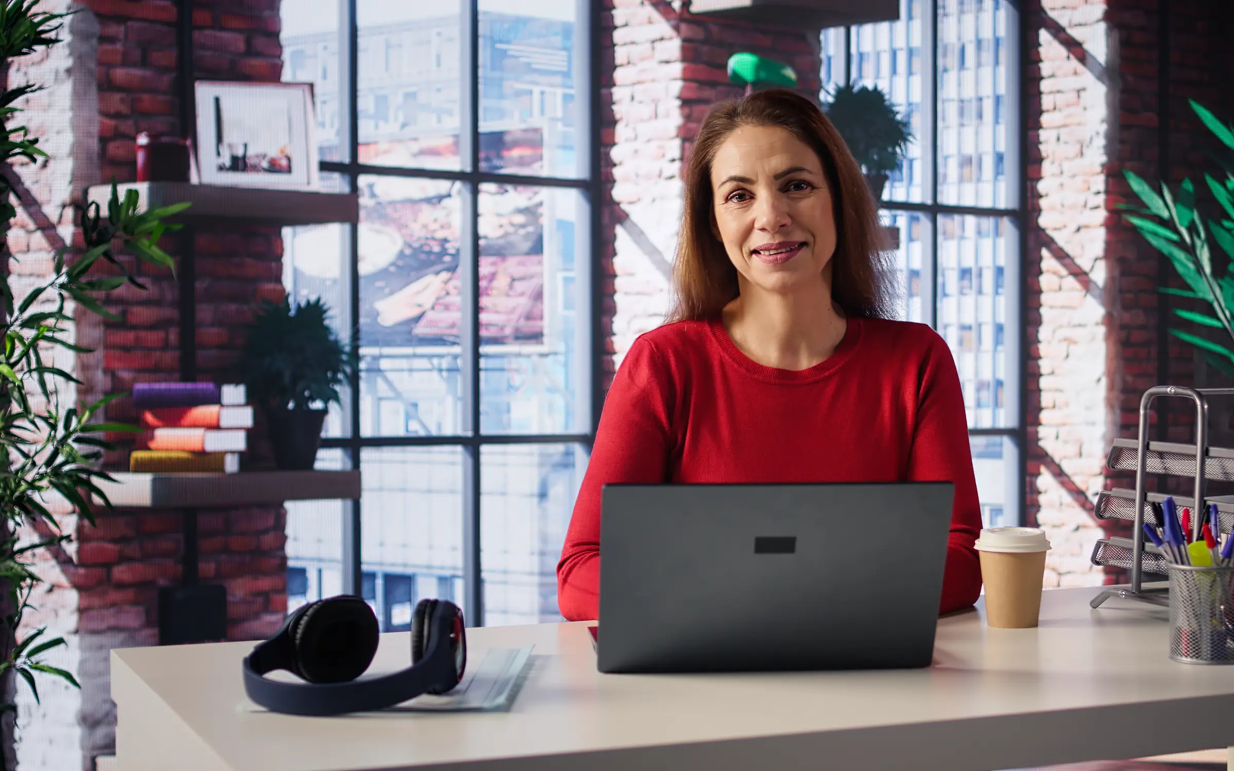 Freelancer managing creative projects in a bright loft office